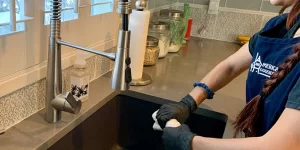housekeeper cleaning kitchen
